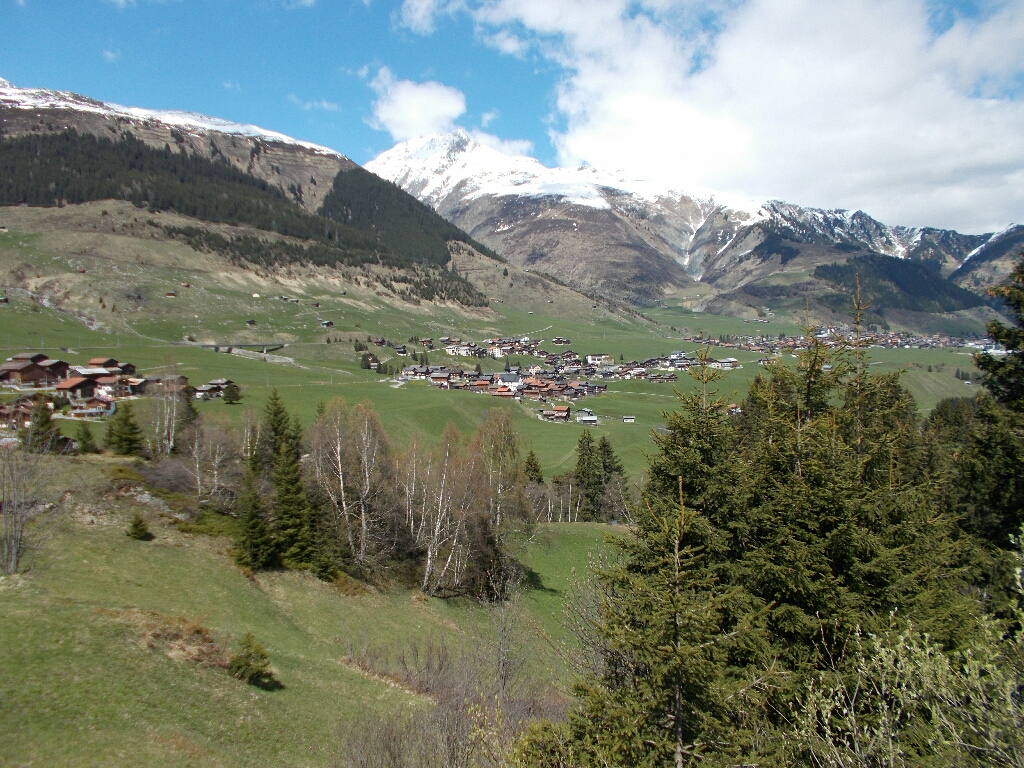 Scenic picture of Sedrun, Switzerland taken down the valley from upstream the Rhine river.