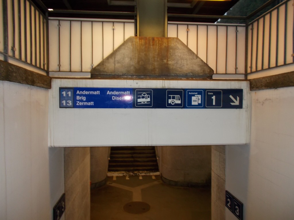 Platform stairs and signage at the Göschenen, Switzerland railway station on May 3, 2014.