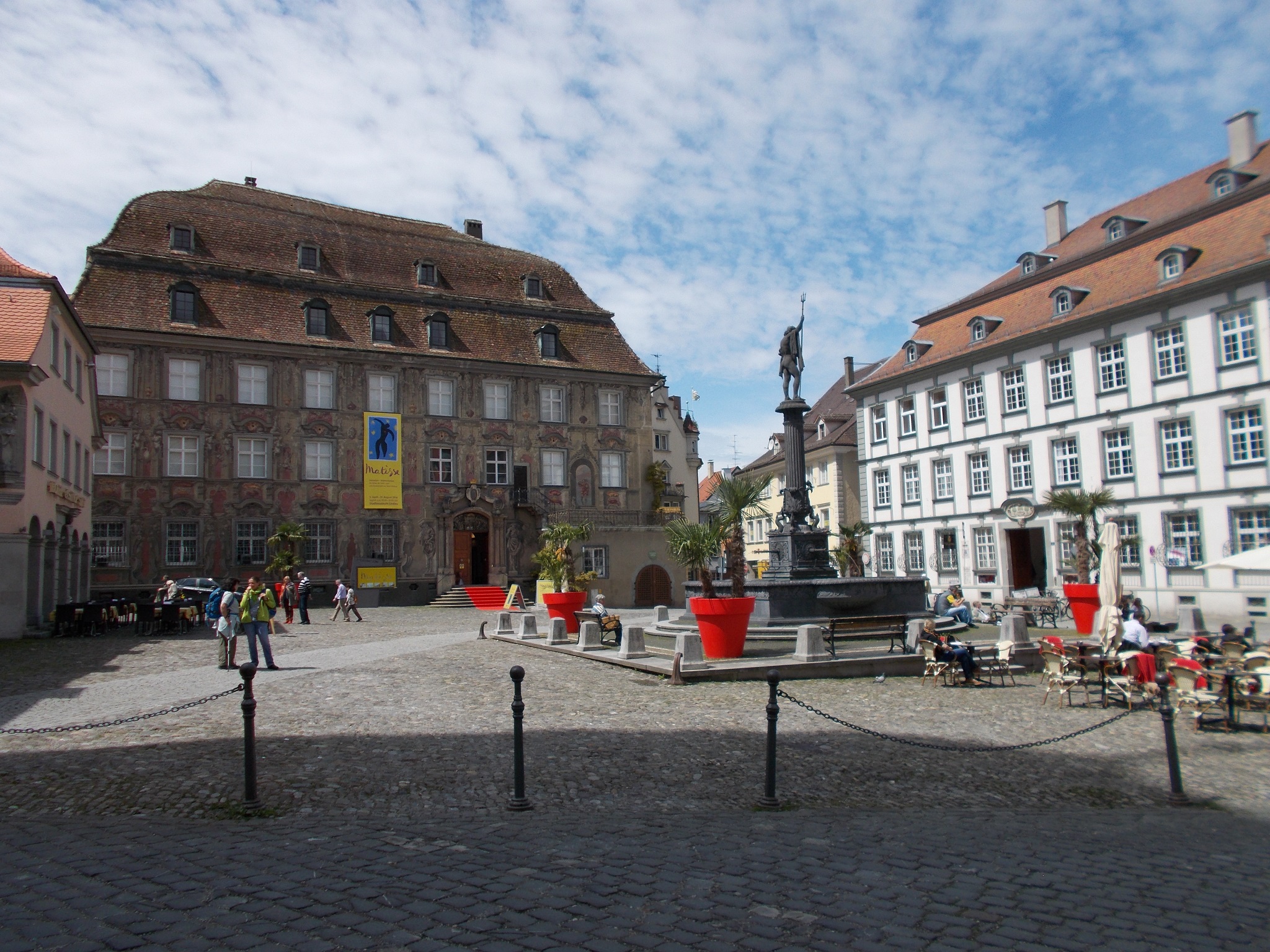 A town square with a fountain at its centre.