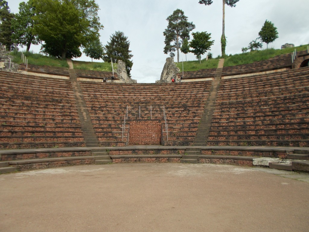 A brickwork Roman amphitheatre photographed from inside the amphitheatre floor.