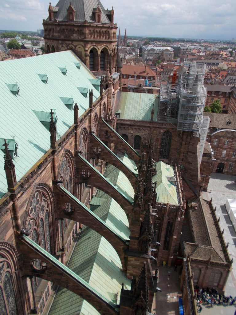 A snapshot of large flying buttresses on a large cathedral.